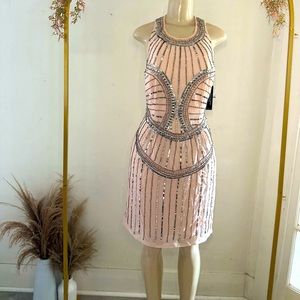 Pink dress with silver sequence. Not stretchy, zipper on side